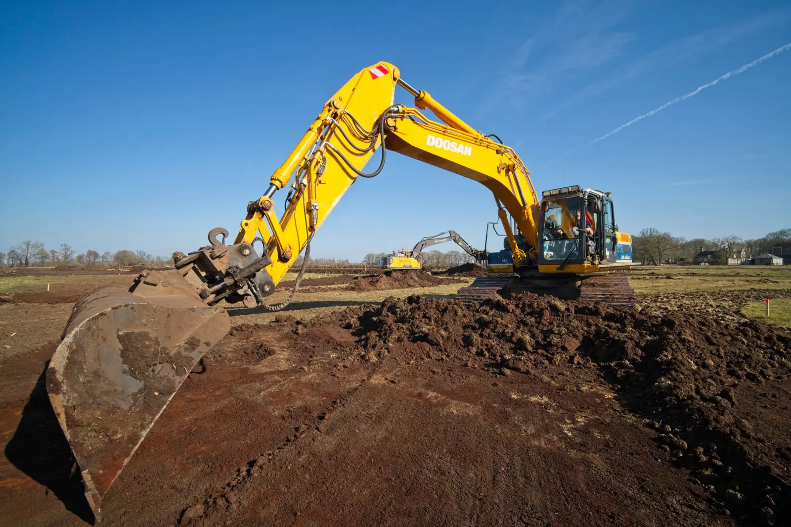 Tracked excavator working on earthworks