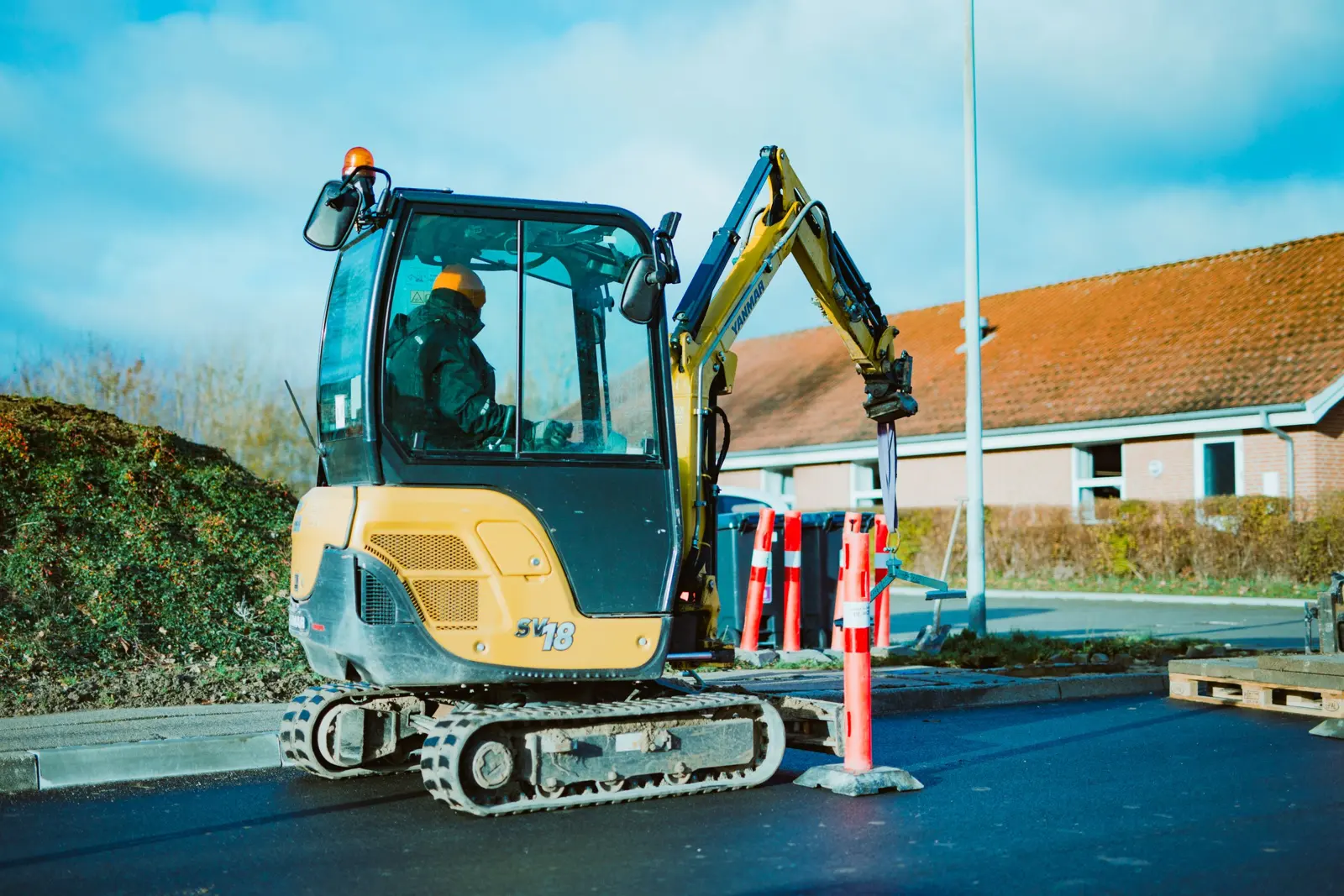 Mini digger working on a UK street