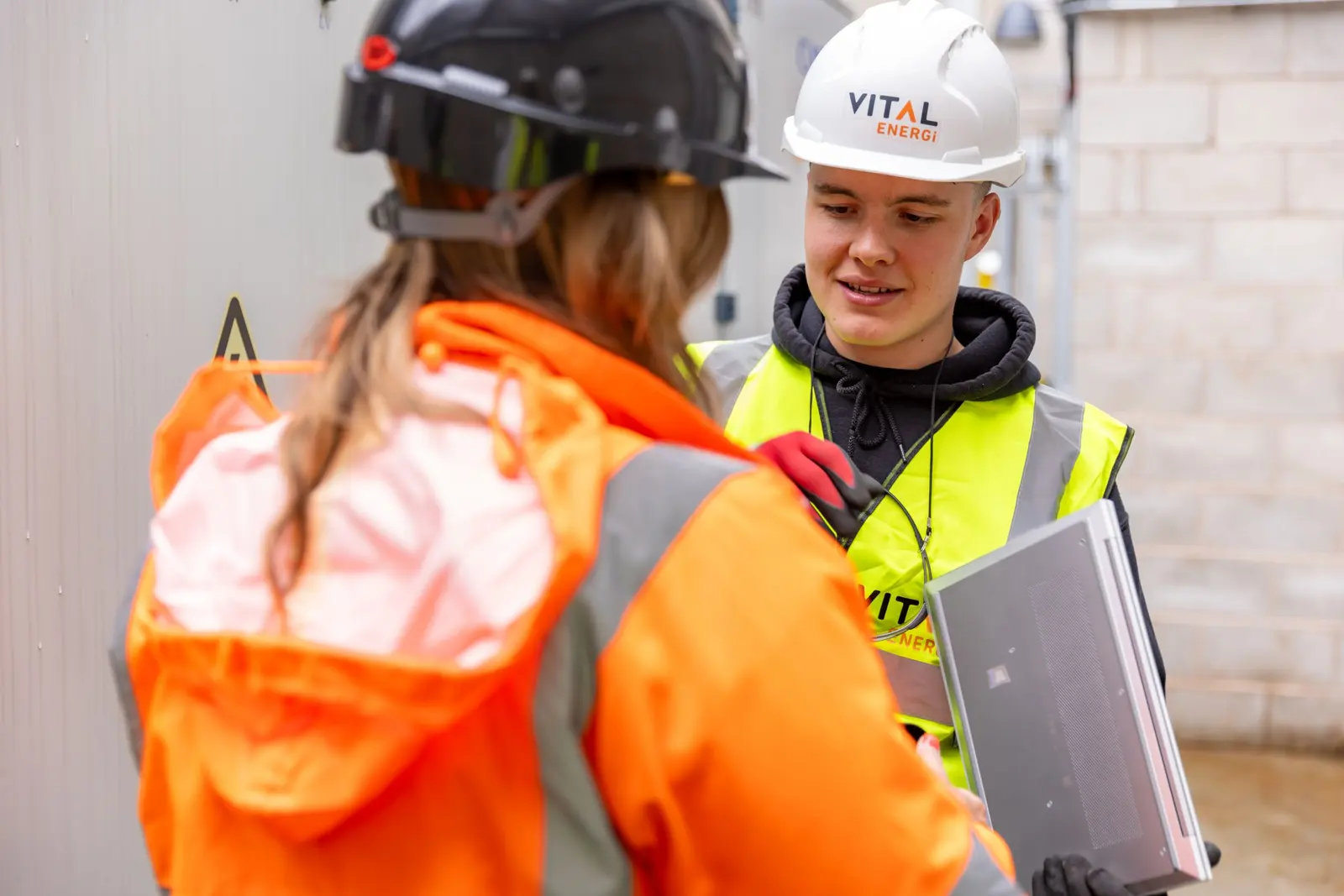 Site team discussing a job on a UK construction site